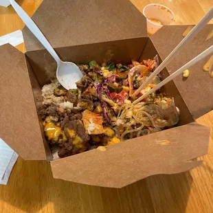 Beef Bulgogi Box with all the fixings.  Included japchae, a little kimchi, and your choice of toppings and sauce.  Thumbs up!