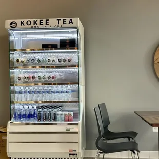 a coffee shop with a beverage cooler