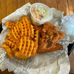 Chicken tenders waffle fries and coleslaw