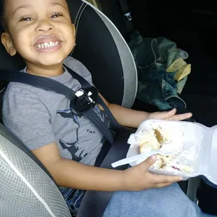 My son devouring his slice of cheesecake! :)