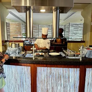 a man and a woman preparing food