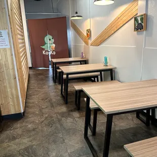 There are just 4 or 5 tables &amp; the couch area, so the feel is more intimate than "open-area &amp; cold." And it's super clean.