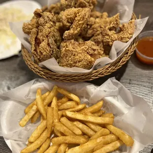 a basket of fried chicken and french fries