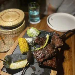 a plate of food on a wooden table