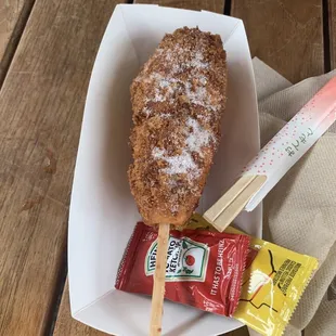 a donut on a stick and a snack bar