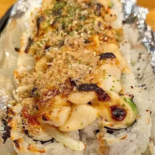 Volcano Roll. Scallops were a little too firm but overall, it&apos;s a slightly sweet roll with a bit of spice to make your mouth feel balanced.