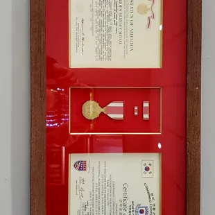 a framed certificate of a military officer