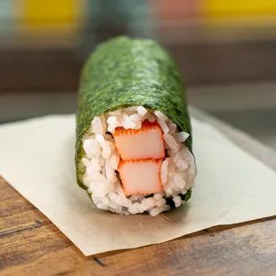 a sushi roll on a piece of paper