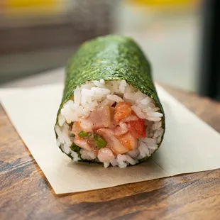 a sushi roll on a piece of paper