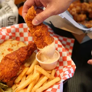 a basket of fried chicken and fries