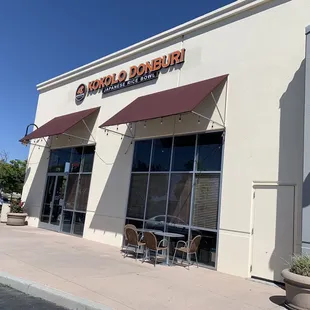 One outside table on this side; saw stacked chairs on other side