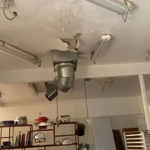 Big ass hole in the ceiling above the a/c unit