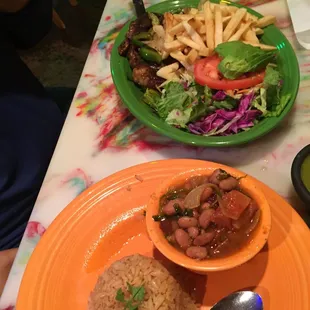 Prime Rib steak with salad, rice, beans, we asked for medium well but it looked raw. Tasty though.