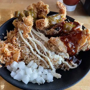 Wing and tender rice bowl. Tenders: curry Wings: sweet orange