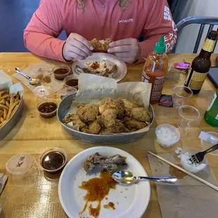 24 wings w/ all the sauces, fries, strawberry Soju, and shiner