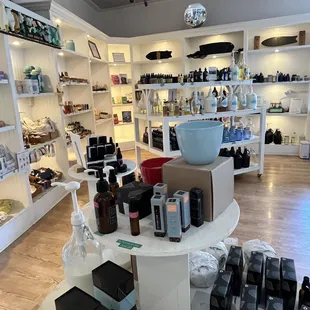 Lots of refillable containers and different household products to fill them with