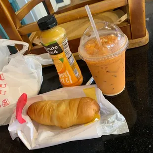 Jumbo Sausage with Cheese Kolache, orange Juice, and Thai ice tea