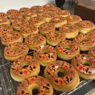 a variety of doughnuts on a cooling rack