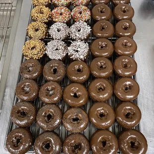 a variety of chocolate donuts