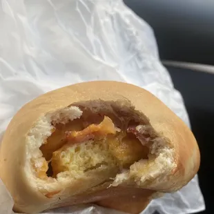 First bite of the bacon egg