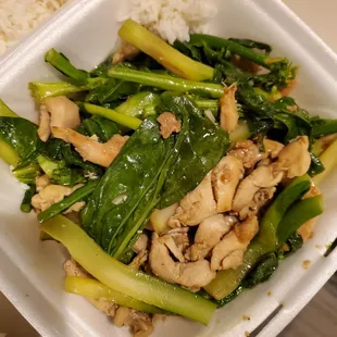 a chicken and broccoli dish in a styrofoam container