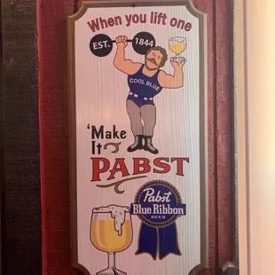 a man holding a glass of beer