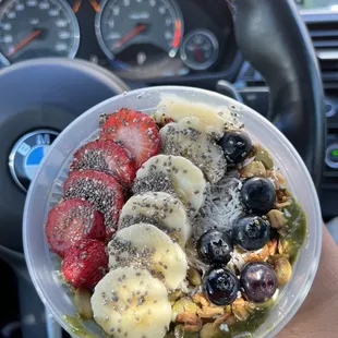 a bowl of fruit and nuts