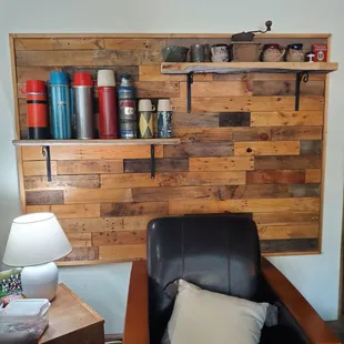a leather chair with a wooden wall behind it