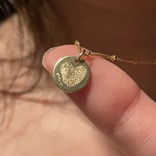 Fingerprint heart engraving.