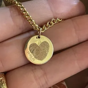 Fingerprint heart engraving.