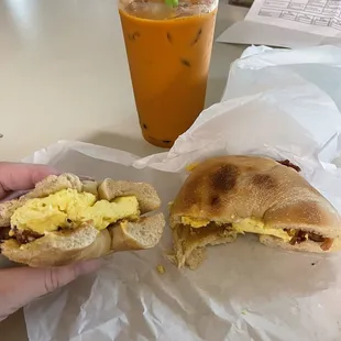 Tai tea, bagel bacon egg and cheese sandwich