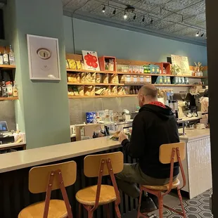 a man sitting at the counter