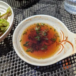 Colored water for tempura dipping sauce. Had no flavor, hardly even considered salty