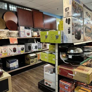 a variety of kitchen appliances on display in a store