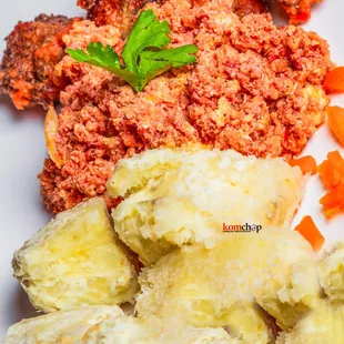 a plate of food with meat, potatoes and carrots