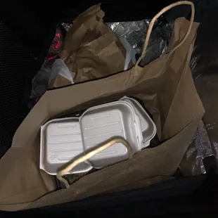 a paper bag with food in it