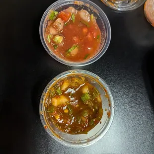 Salsa that is served with in-house chips and a spicy kimchi salsa/hot sauce.