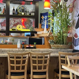 a bar with wooden chairs and tables