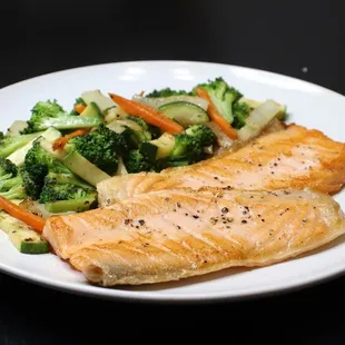 a plate of fish and vegetables