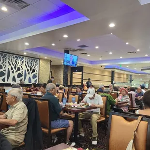 a large group of people sitting at tables