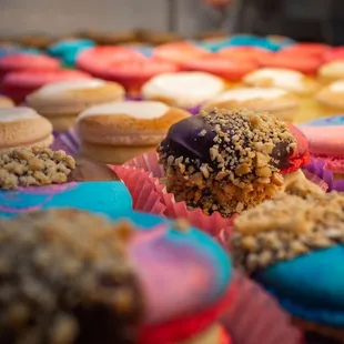 a variety of colorful cupcakes
