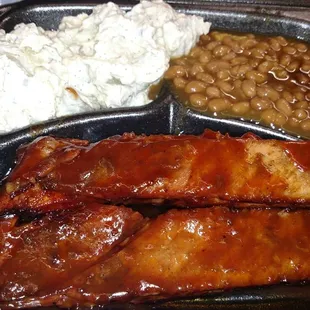 1/4 rack of ribs with potato salad and baked beans, $13