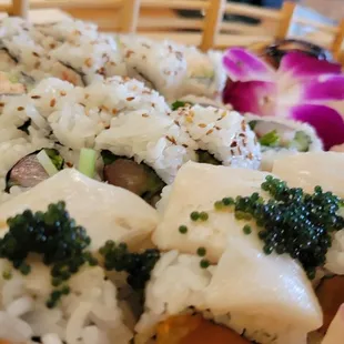 a variety of sushi on a tray