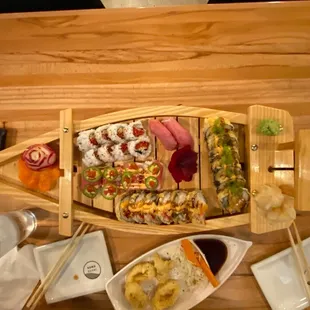 Sushi boat...fun and delicious.  Great sushi and awesome staff.  Highly recommend for those that appreciate good fresh sushi.