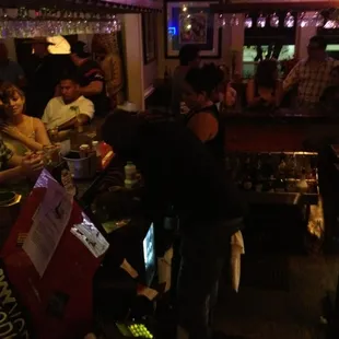 a bartender serving customers