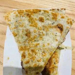 two pieces of pizza on a plate