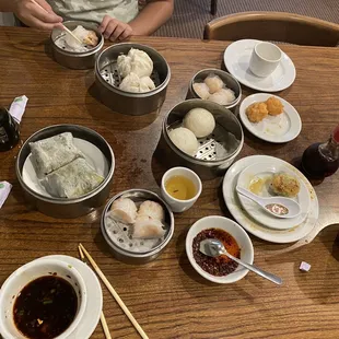 A selection of dim sum dishes... shrimp dumplings, fried shrimp ball, vegetarian sticky rice, egg custard bun