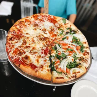 Half pepperoni/sausage pizza and garden salad pizza