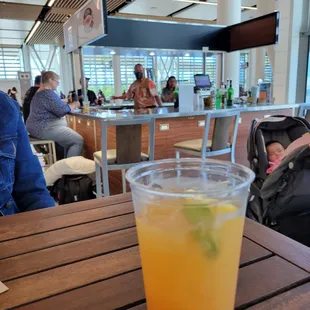 a drink in a plastic cup on a table