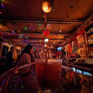 a woman sitting at the bar